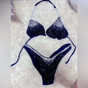 Brand new, navy blue with rhinestones figure, competition suit.